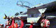 AIM-9 Sidewinder being loaded by armourers